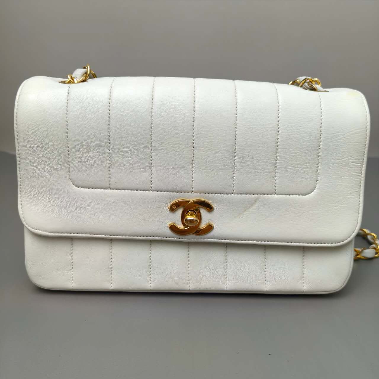 Chanel Vertical Quilted Flap Bag in White Leather