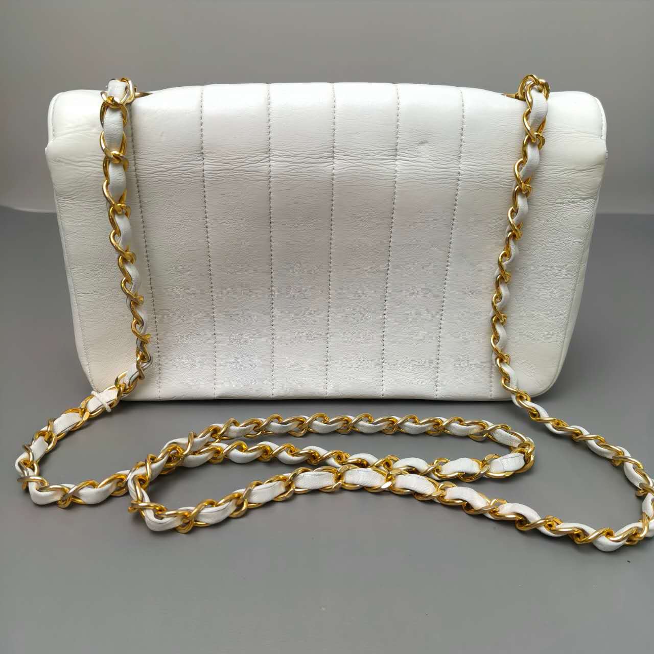 Chanel Vertical Quilted Flap Bag in White Leather