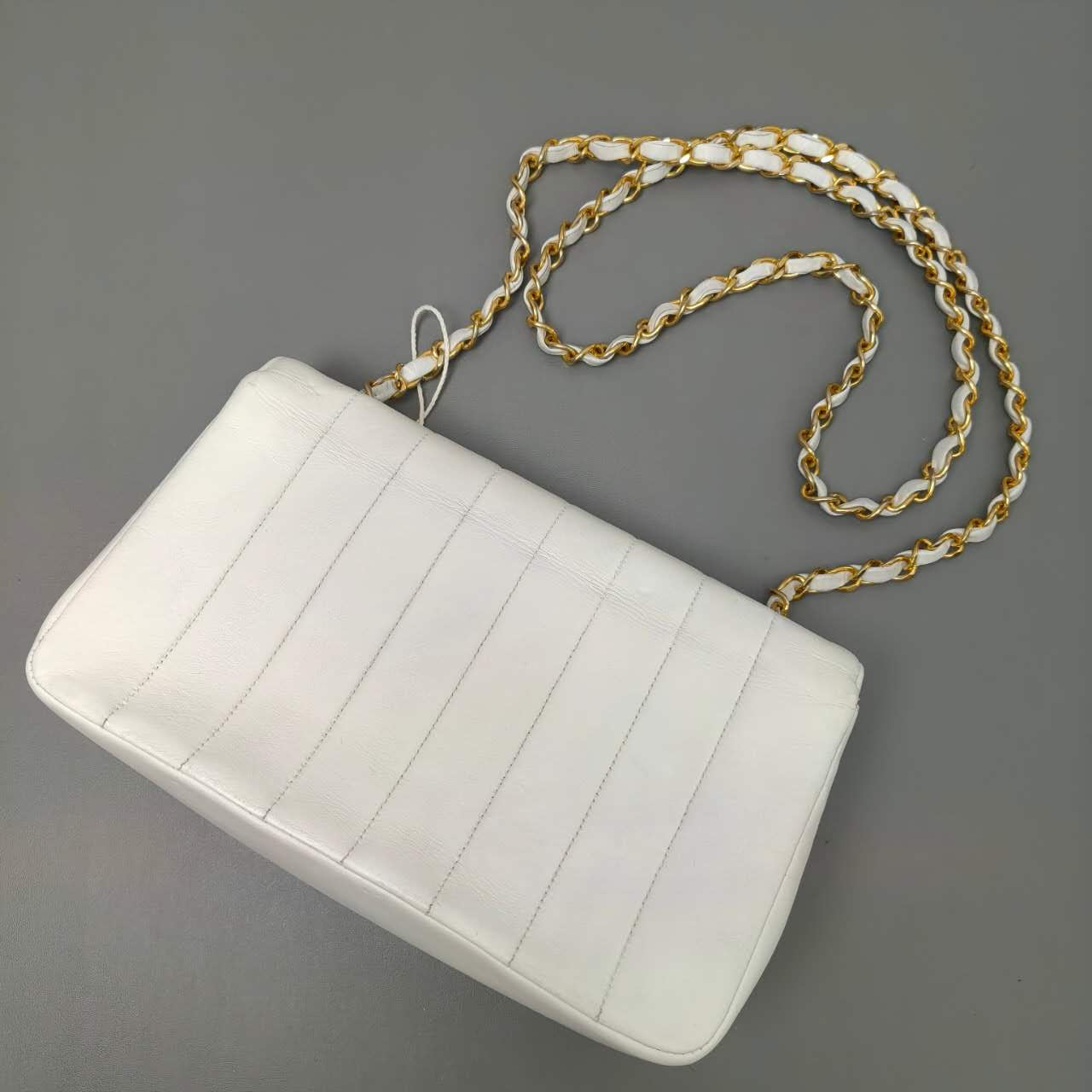Chanel Vertical Quilted Flap Bag in White Leather