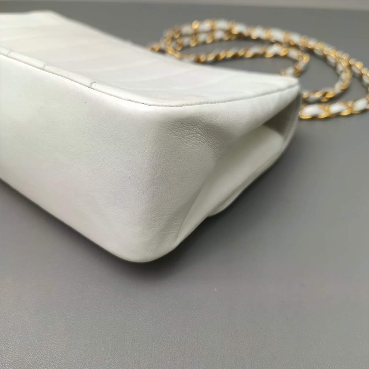 Chanel Vertical Quilted Flap Bag in White Leather