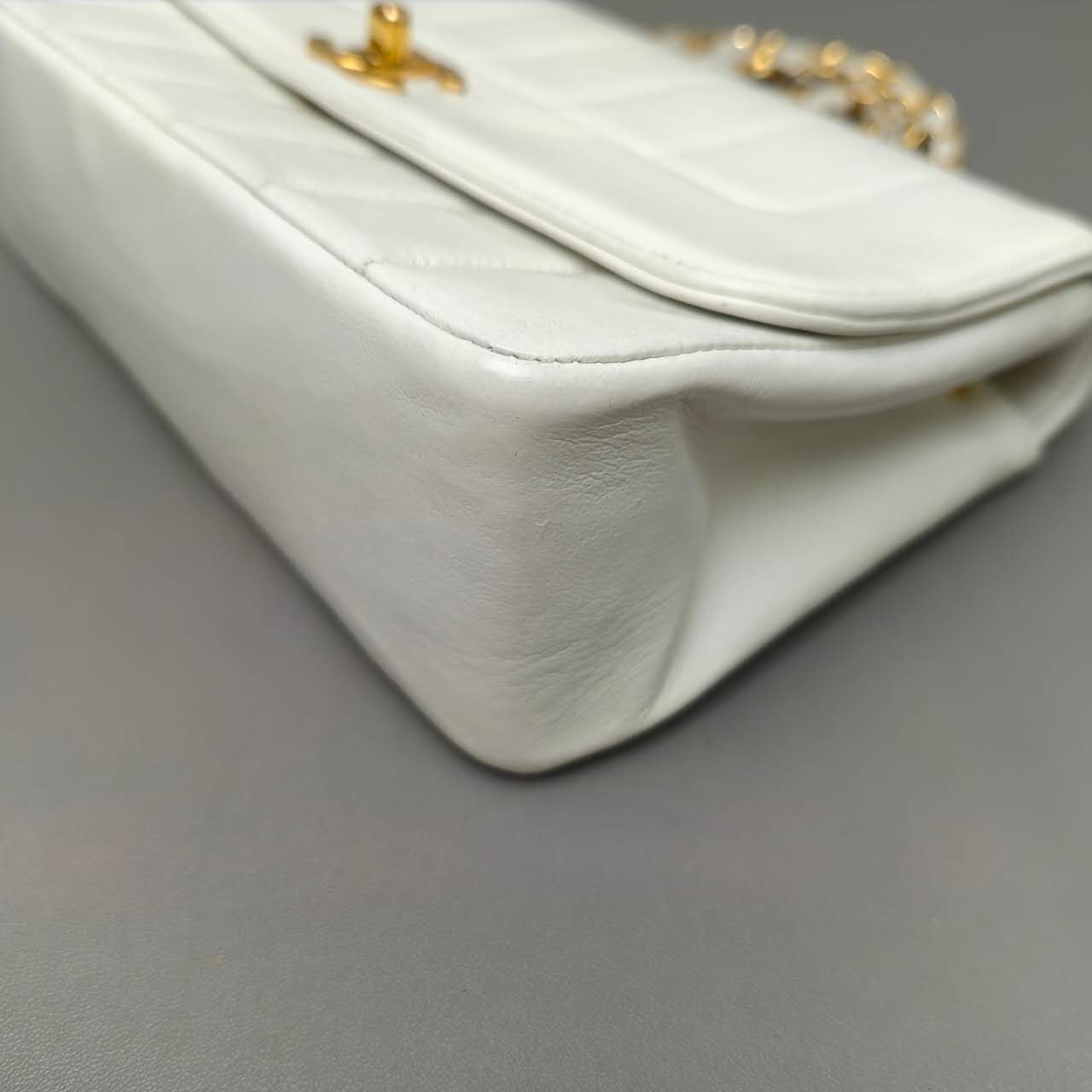 Chanel Vertical Quilted Flap Bag in White Leather